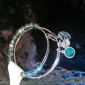 2 Alex and Ani bangles silver and beaded green gem's with diamond accent beads .